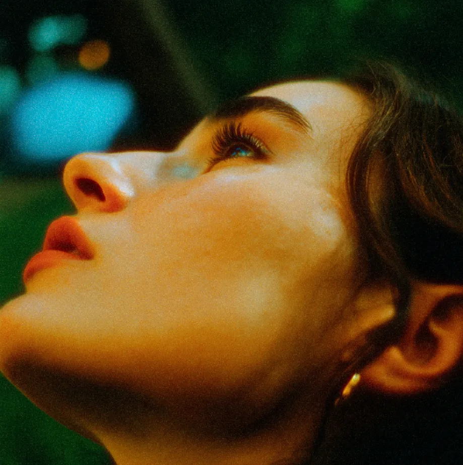 Close-up portrait with bold colors and visible grain, emulating artsy 35mm film using Color.io’s LUT creation tools